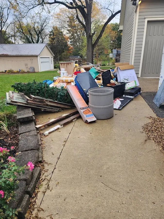 Dumpster being loaded with debris for 3 Yard Dumpster Rental in Union Grove